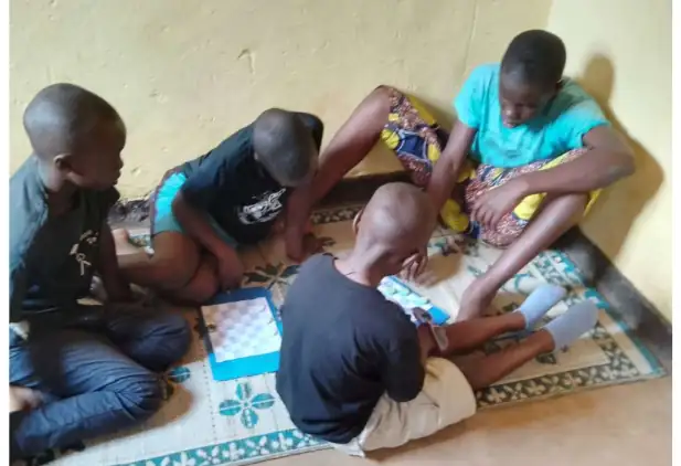 Maths Camp participant sharing what he learnt at the camp with friends and siblings: maths can fit the people, the place, and the culture it serves.